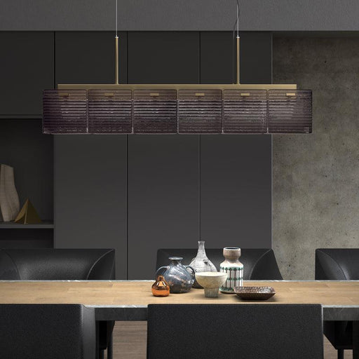 Large, modern wall sconce with a rectangular, metallic frame, angled view.