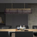 Large, modern wall sconce with a rectangular, metallic frame, angled view.