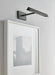 A rectangular black outdoor wall light with a textured finish casting light downwards.