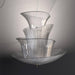 Large, modern wall sconce with a rectangular, textured glass panel, illuminated.