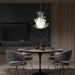 Large, modern wall sconce with a rectangular, textured glass panel.