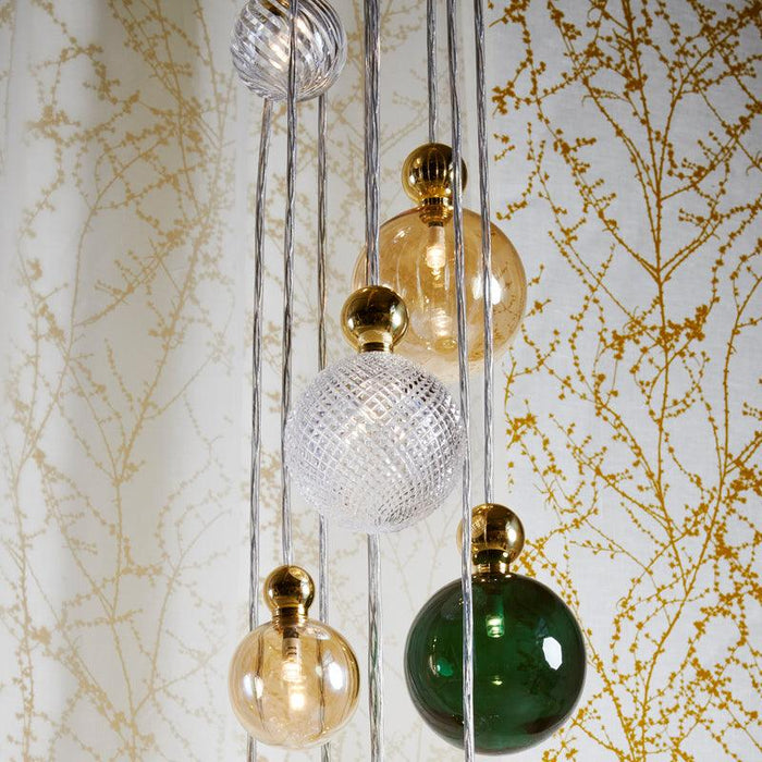 Large, modern chandelier with five light sources, angled view.