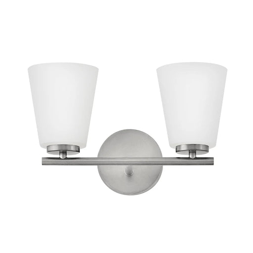 A modern outdoor wall lantern with a bronze finish and clear glass panels featuring a rectangular design.