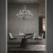 Large, modern wall sconce with a curved, metallic body, side view.