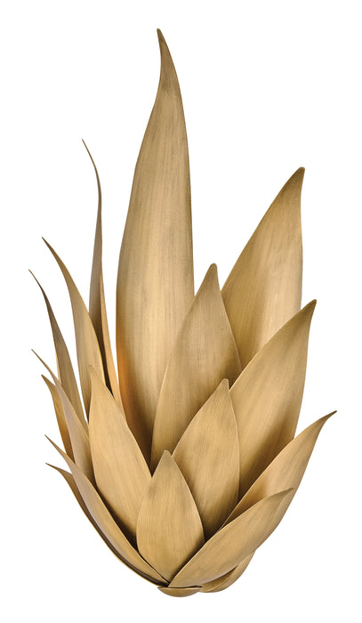 An angled view of a textured gold and black abstract wall art piece.