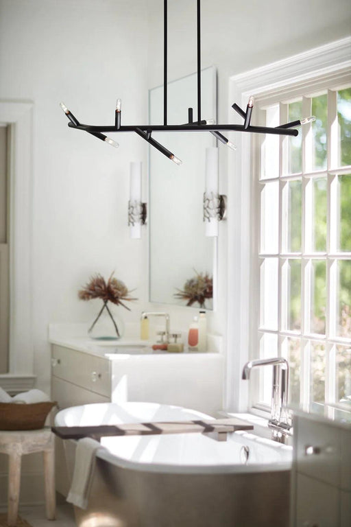 Small black and bronze modern pendant light with a spherical frosted glass shade.